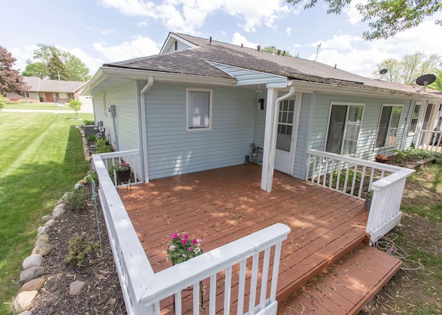 wooden deck featuring a yard