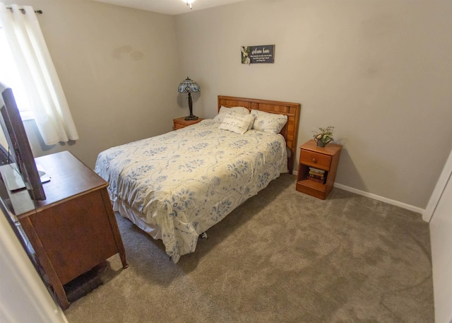 bedroom featuring carpet flooring and baseboards