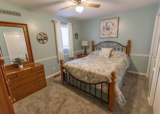 carpeted bedroom with baseboards and ceiling fan