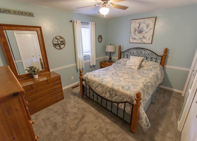 bedroom with carpet flooring, baseboards, and a ceiling fan