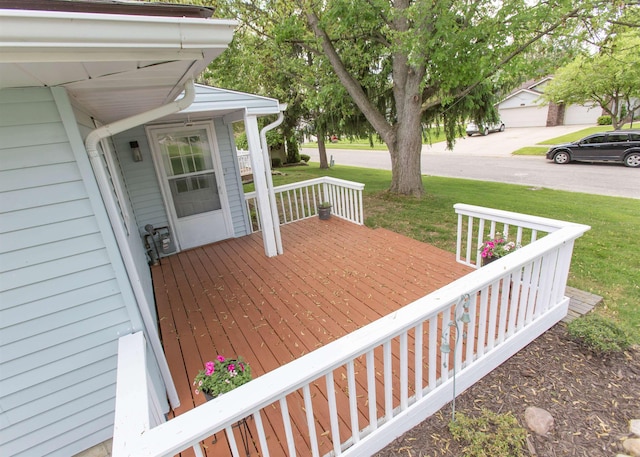 wooden deck featuring a yard and a porch