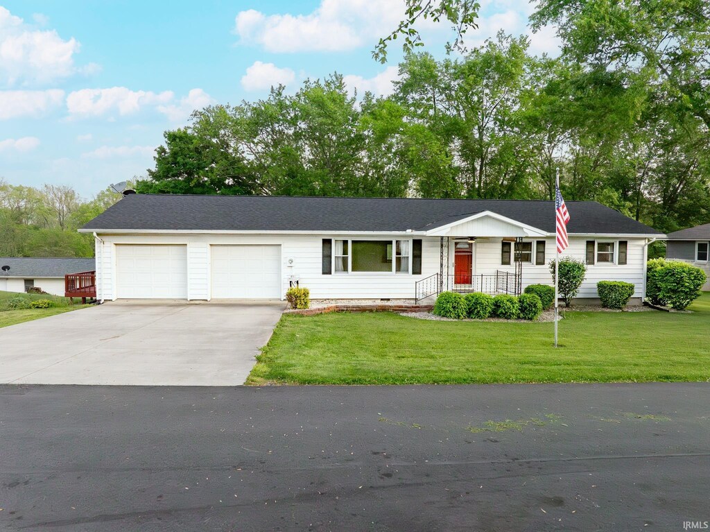 210 E Branson St, Lafontaine, IN 46940 - single story home featuring driveway, an attached garage, a front lawn, and crawl space