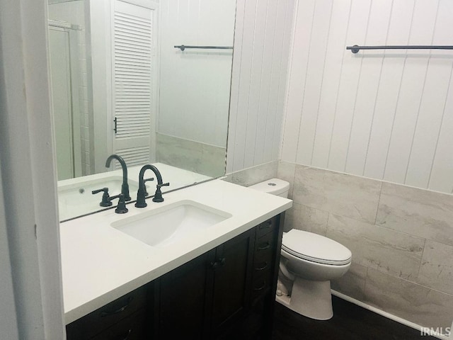 bathroom with toilet and vanity