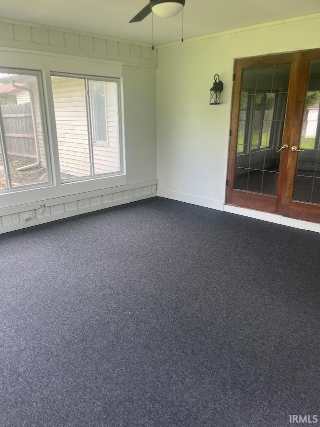 unfurnished sunroom with french doors