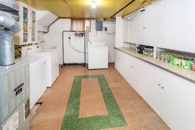 6408 Washington Ave, Evansville, IN 47715 - laundry room featuring washing machine and clothes dryer, light flooring, and electric panel