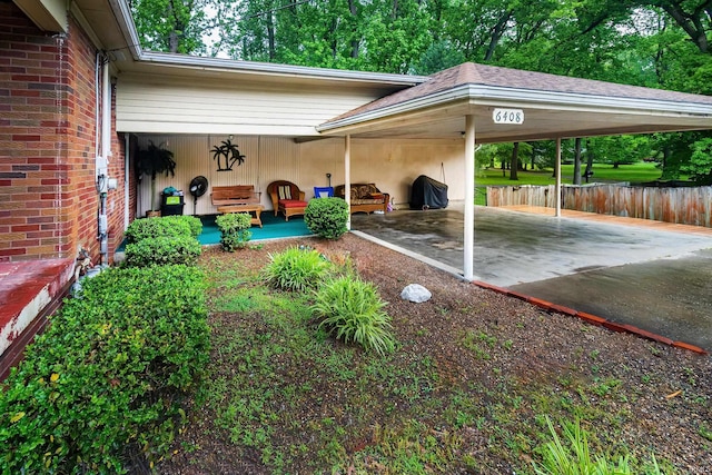 6408 Washington Ave, Evansville, IN 47715 - view of patio featuring an attached carport and fence