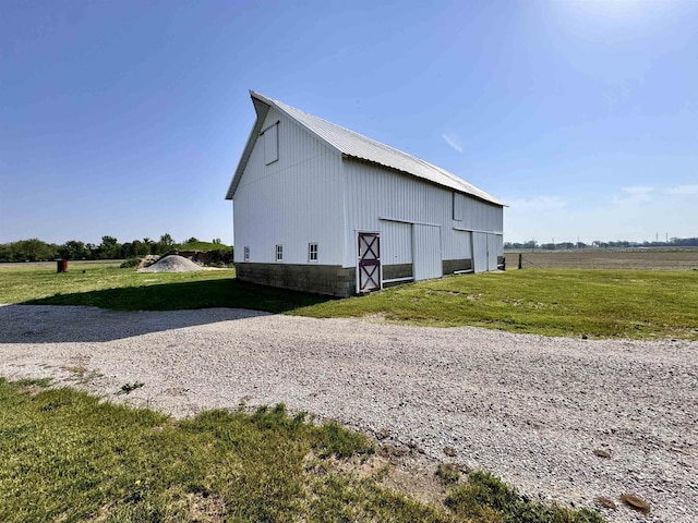 view of barn with a lawn