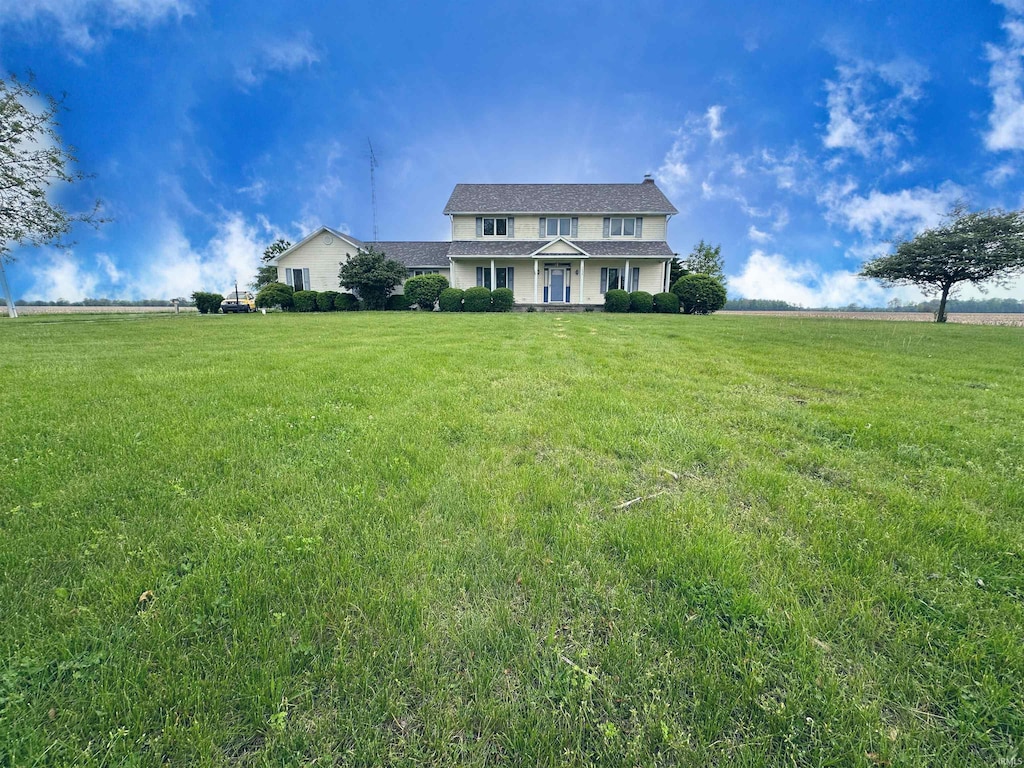 7034 S 550 E, Peru, IN 46970 - view of front facade with a front yard and a view of rural / pastoral area
