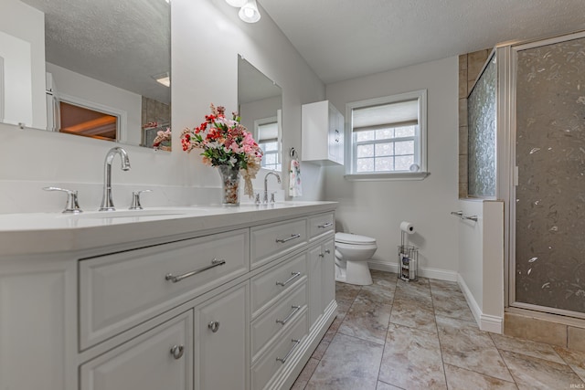 7680 Saint Jordan Cir, Newburgh, IN 47630 - full bath featuring double vanity, a shower stall, a textured ceiling, toilet, and baseboards