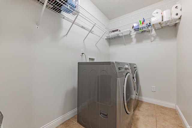 7680 Saint Jordan Cir, Newburgh, IN 47630 - laundry room featuring separate washer and dryer, baseboards, and tile patterned flooring
