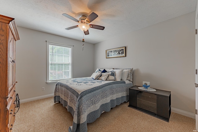 7680 Saint Jordan Cir, Newburgh, IN 47630 - bedroom with light colored carpet, baseboards, ceiling fan, and a textured ceiling