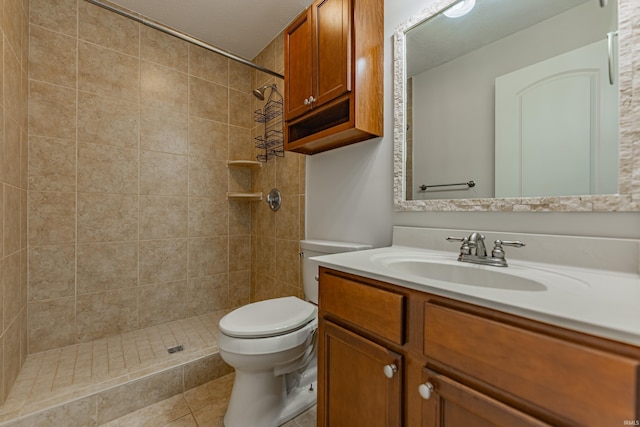 7680 Saint Jordan Cir, Newburgh, IN 47630 - bathroom featuring vanity, toilet, a tile shower, and tile patterned flooring