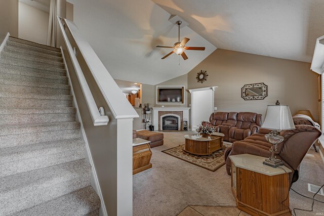 7680 Saint Jordan Cir, Newburgh, IN 47630 - living area with a ceiling fan, light carpet, lofted ceiling, stairs, and a tiled fireplace