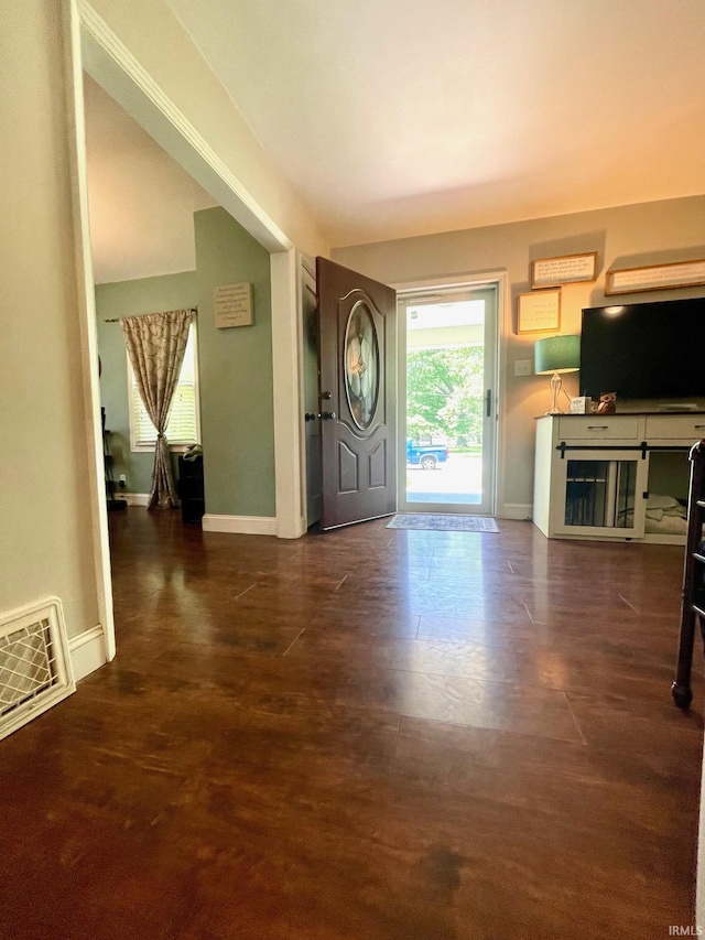 1304 Parkside Dr, Evansville, IN 47714 - entryway featuring baseboards, wood finished floors, and heating unit