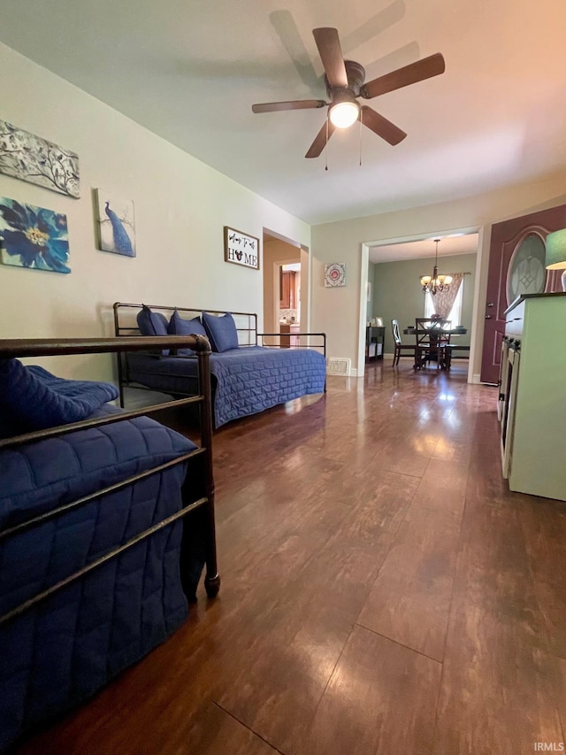 1304 Parkside Dr, Evansville, IN 47714 - bedroom featuring a chandelier and dark wood-style floors