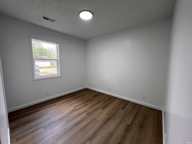 2108 W Memorial Dr, Muncie, IN 47302 - unfurnished room featuring wood finished floors and baseboards