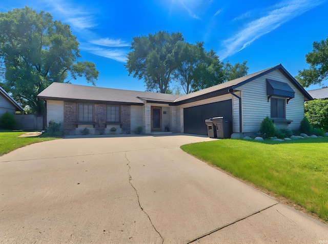 2104 Valdez Dr, Lafayette, IN 47905 - ranch-style home featuring concrete driveway, a front lawn, and a garage