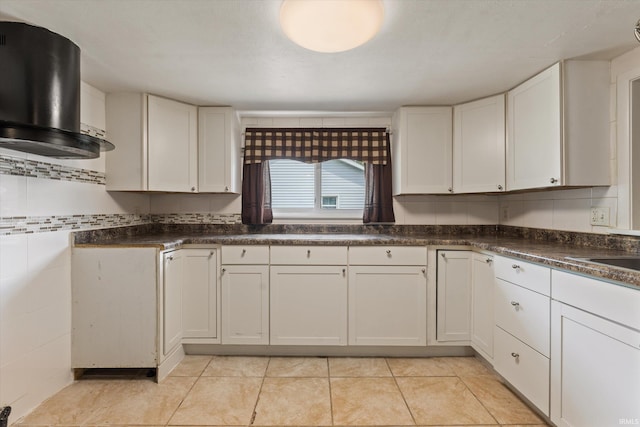 114 S Grand St, Lakeville, IN 46536 - kitchen with white cabinets, dark countertops, light tile patterned floors, and a sink
