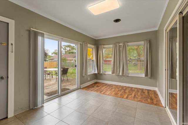 114 S Grand St, Lakeville, IN 46536 - unfurnished sunroom with tile patterned floors, baseboards, and ornamental molding