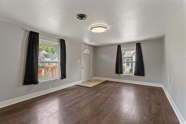 114 S Grand St, Lakeville, IN 46536 - entrance foyer with dark wood-style flooring and baseboards