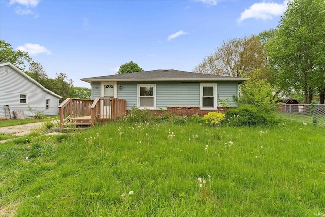 114 S Grand St, Lakeville, IN 46536 - back of property with fence and a wooden deck