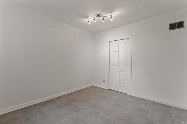114 S Grand St, Lakeville, IN 46536 - tiled empty room with baseboards