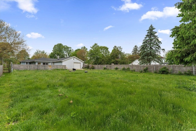 114 S Grand St, Lakeville, IN 46536 - view of yard with fence and a garage
