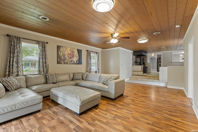 114 S Grand St, Lakeville, IN 46536 - living area with wood ceiling, light wood finished floors, ceiling fan, crown molding, and baseboards