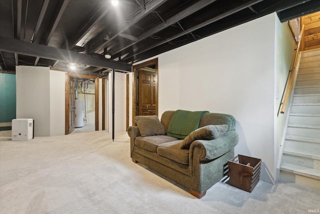 finished below grade area featuring gas water heater, stairway, and carpet floors