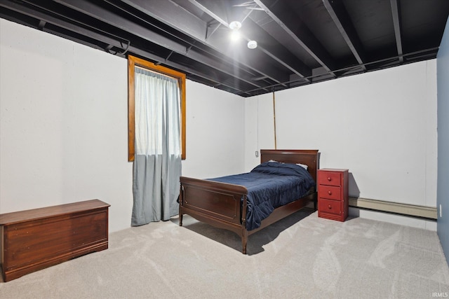 carpeted bedroom featuring a baseboard heating unit