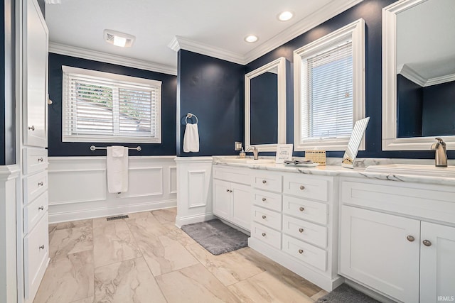 411 Auditorium Blvd, Winona Lake, IN 46590 - bathroom featuring crown molding, wainscoting, marble look tile flooring, double vanity, and recessed lighting