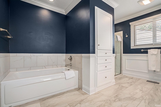 411 Auditorium Blvd, Winona Lake, IN 46590 - full bath featuring wainscoting, marble look tiles, a bath, crown molding, and a stall shower
