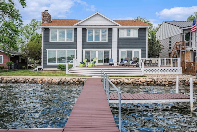 411 Auditorium Blvd, Winona Lake, IN 46590 - rear view of house with a chimney, a water view, and a shingled roof
