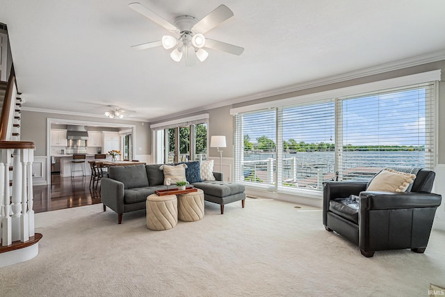 411 Auditorium Blvd, Winona Lake, IN 46590 - carpeted living room featuring crown molding and ceiling fan