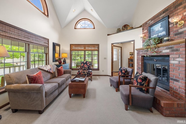 living room with carpet floors, a fireplace, baseboards, and high vaulted ceiling