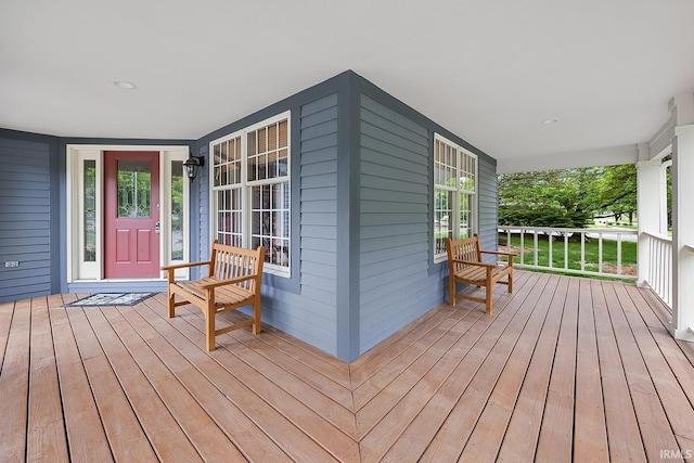 wooden terrace featuring covered porch