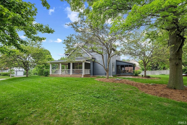 back of property featuring a sunroom