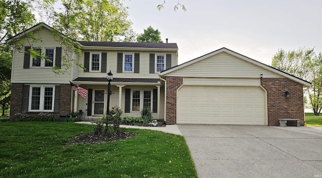 view of front of home with brick siding, a garage, concrete driveway, and a front yard