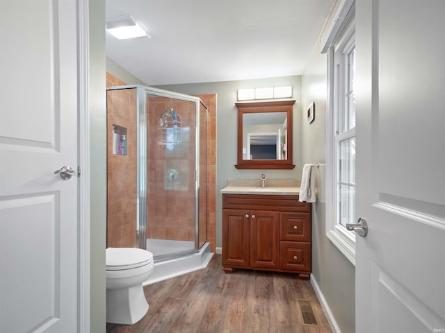 4904 Live Oak Ct, Fort Wayne, IN 46804 - full bathroom featuring a shower stall, vanity, wood finished floors, and toilet