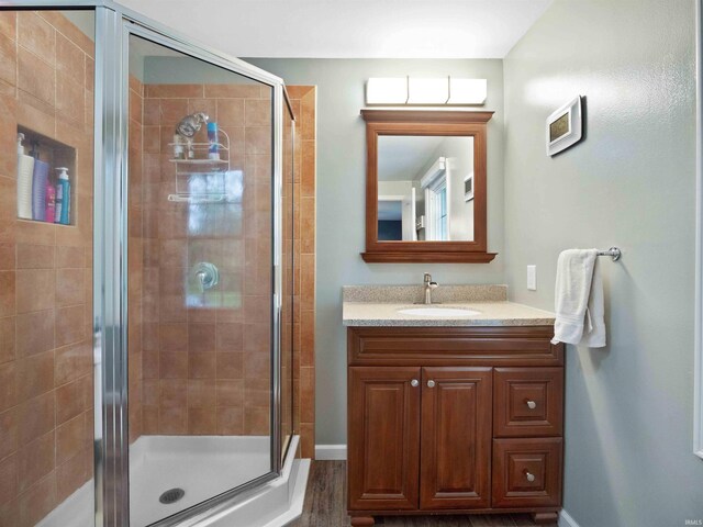 4904 Live Oak Ct, Fort Wayne, IN 46804 - full bath featuring a shower stall, vanity, and baseboards