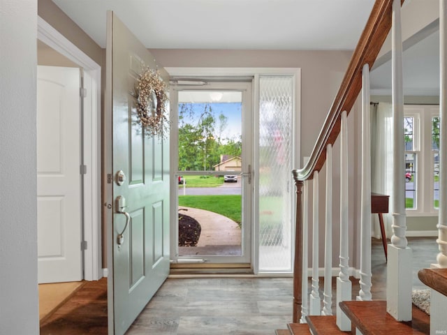 4904 Live Oak Ct, Fort Wayne, IN 46804 - entrance foyer featuring stairway, plenty of natural light, and wood finished floors