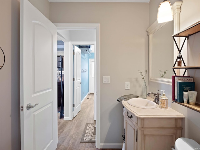 4904 Live Oak Ct, Fort Wayne, IN 46804 - half bath with vanity, wood finished floors, baseboards, and toilet
