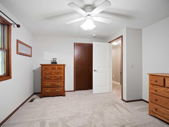 4904 Live Oak Ct, Fort Wayne, IN 46804 - bedroom with light carpet, a closet, baseboards, and a ceiling fan