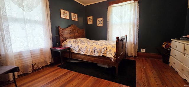 718 N Cherry St, Mount Carmel, IL 62439 - bedroom with wood finished floors and crown molding
