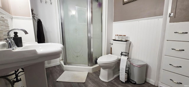 718 N Cherry St, Mount Carmel, IL 62439 - full bathroom with wood finished floors, a shower stall, wainscoting, and toilet