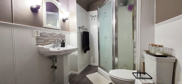 718 N Cherry St, Mount Carmel, IL 62439 - bathroom with toilet, a stall shower, and wood finished floors