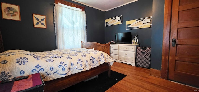 718 N Cherry St, Mount Carmel, IL 62439 - bedroom with wood finished floors and ornamental molding
