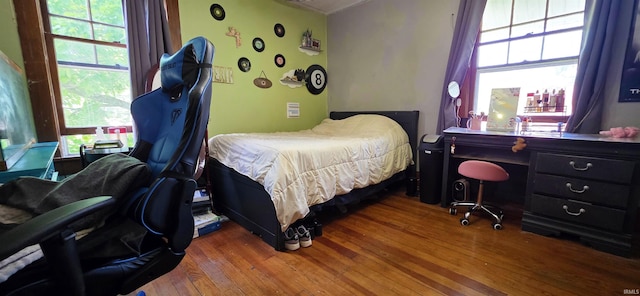 718 N Cherry St, Mount Carmel, IL 62439 - bedroom with wood finished floors, multiple windows, and a desk