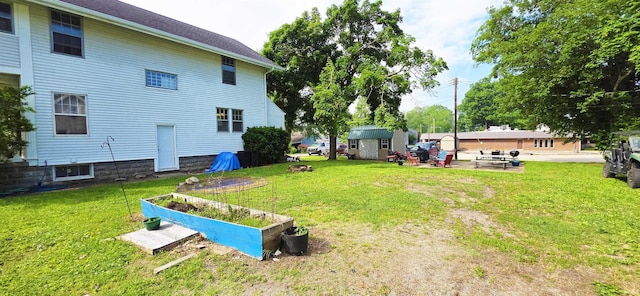 718 N Cherry St, Mount Carmel, IL 62439 - view of grassy yard featuring a garden