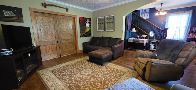 718 N Cherry St, Mount Carmel, IL 62439 - living area with a chandelier, stairs, arched walkways, and wood finished floors
